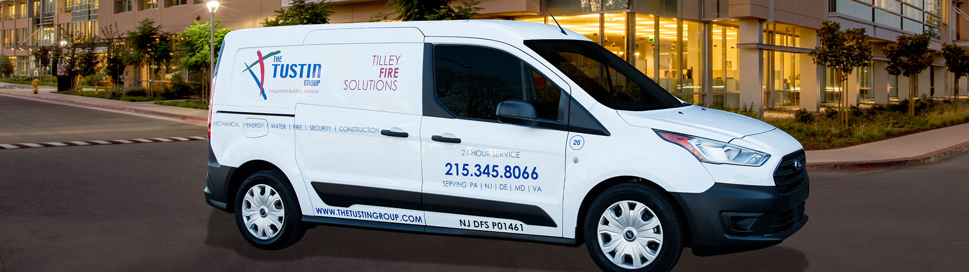 Tustin Tilley Fire Solutions service van outside a commercial building